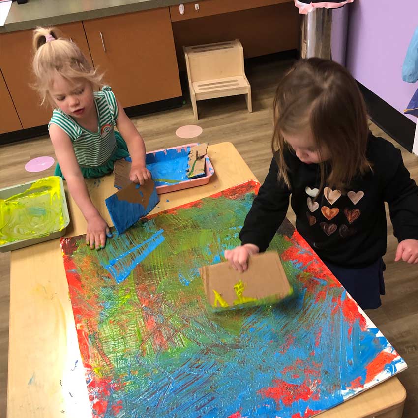 girls at table painting