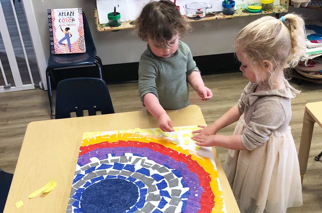 kids making art with construction paper