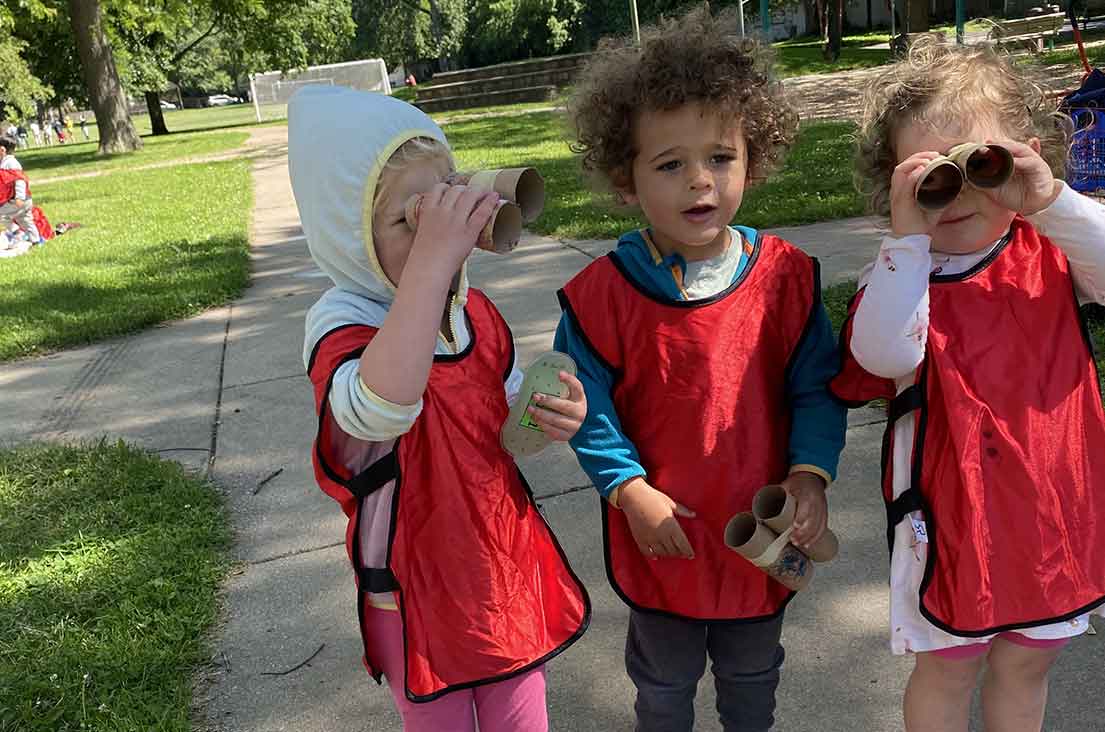 Kids exploring with binoculars